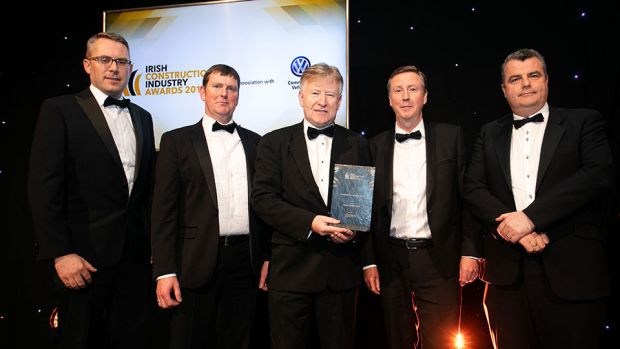 David Harpur, Managing Director, Diatec presents the Contractor of the Year award to the Collen Construction team.
