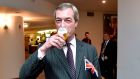 Britain’s Brexit Party leader Nigel Farage drinks a beer on the sidelines of a European Parliament plenary session in Brussels on Thursday. Photograph: John Thys/ AFP/Getty Images