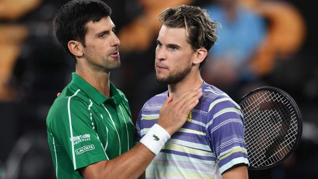 Novak Djokovic consoles Dominic Thiem after his victory in Melbourne. Photograph: Greg Wood/Getty/AFP