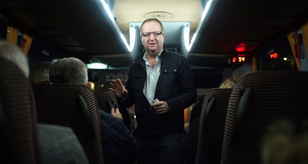 Cork South-West TD Michael Collins speaks to passengers on a bus bringing people to Belfast for cataract operations. Photograph: Enda O’Dowd