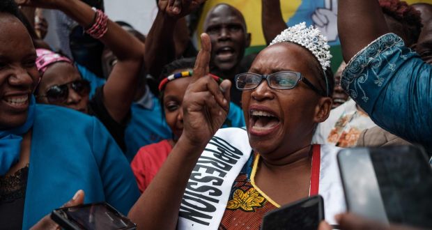 Ugandan activist and writer Stella Nyanzi speaks  outside the court in Kampala on Thursday after a judge overturned her conviction for cyber harassment of president Yoweri Museveni. Photograph: Sumy Sadurni/AFP via Getty Images