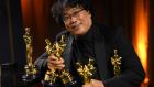 Director Bong Joon Ho poses with his Oscars. US president Donald Trump scorned the best picture  award for Bong’s film Parasite, asking how a South Korean film could win. Photograph: Valerie Macon/AFP via Getty