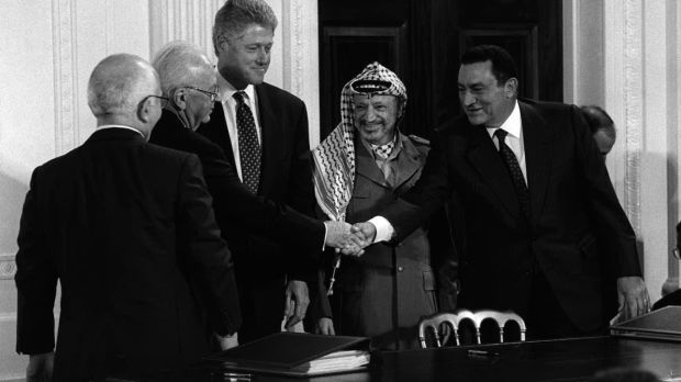 President Hosni Mubarak of Egypt, right, shakes hands with prime minister Yitzhak Rabin of Israel as King Hussein of Jordan, left, US president Bill Clinton, third from left, and Palestinian leader Yasser Arafat look on before the signing of a peace accord at the White House on September 28th, 1995. Photograph: Stephen Crowley/The New York Times