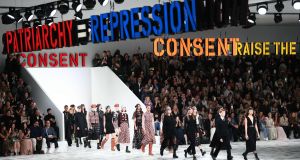 Statements including Women Raise The Uprising, We Are All Clitoridian Women, and Consent, adorned the hall for the Dior show at Paris Fashion Week on Tuesday. Photograph: Anne-Christine Poujoulat/AFP/Getty Images