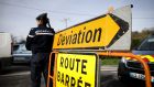 Police close a road near  Branville, Normandy, last Friday, ahead of the arrival of 34 French citizens by bus following their  evacuation from the Chinese city of Wuhan, which is at the centre of the coronavirus outbreak. Photograph: Lou Benoist/AFP via Getty Images