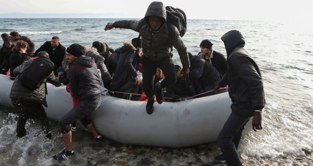 Migrants from Syria, Iraq and sub-saharan African countries arrive on a dinghy near the city of Mytilene, after crossing part of the Aegean Sea from Turkey to the island of Lesbo on Sunday. Photograph: Elias Marcou/Reuters 