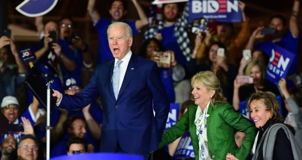Democratic presidential hopeful Joe Biden arrives on stage with his wife Jill (centre) and sister Valerie Biden Owens for a Super Tuesday event in Los Angeles. Photograph: Frederic J. Brown/AFP via Getty Images.