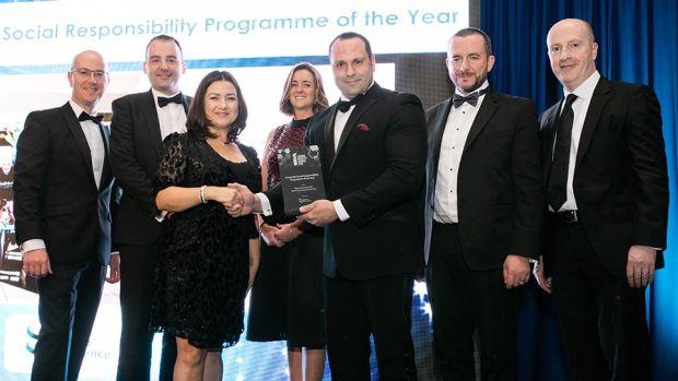 John Calvo, Site Manager, Source BioScience Ireland presents the Corporate Social Responsibility Programme of the Year award to the West Pharmaceutical Services team.