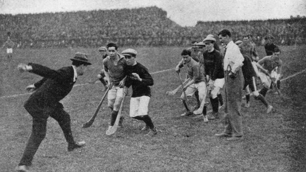 Michael Collins throws in the ball to start a hurling match at Croke Park, Dublin. Photograph: Hogan/Hulton Archive/ Getty Images