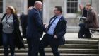 Knees up: Fianna Fáil Senator Diarmuid Wilson gets a friendly knee from Labour’s Alan Kelly  on the Plinth on Thursday. Photograph: Nick Bradshaw for The Irish Times