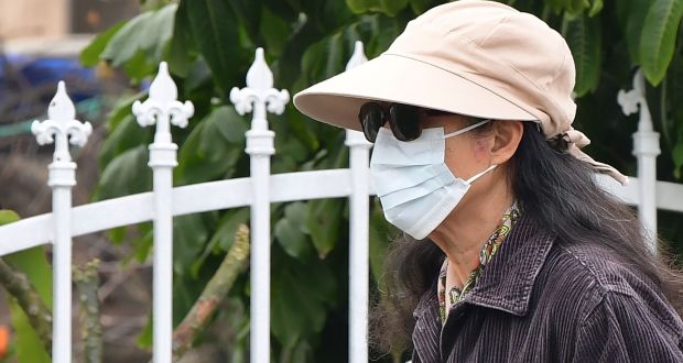 A woman wearing a face mask in Monterey Park, California. Photograph:  Frederic J Brown/AFP/Getty Images
