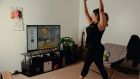 Tiffany Ruiz working out with Nintendo’s Ring Fit Adventure game at home in Bakersfield, California. Photograph: Rozette Rago/The New York Times