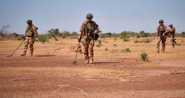  French soldiers use detectors to  search for improvised explosive devices during the Burkhane Operation in northern Burkina Faso, in November 2019. File photograph: Michele Cattani/AFP via Getty