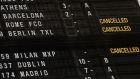  A flight departure board shows cancelled fligths to Italy and Germany over  coronavirus. Photograph: Stephanie Lecocq