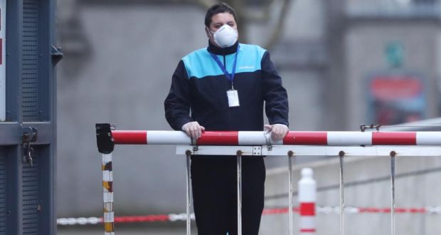 A security guard wearing a face mask at Croke Park in Dublin,  where the stadium is being used as a testing facility for Covid-19. Photograph: Niall Carson/PA Wire 