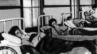 Mary Mallon (First from left) in a hospital bed. She was forcibly quarantined as a carrier of typhoid fever in 1907 for three years and then again from 1915 until her death in 1938. Photograph: Wikimedia Commons