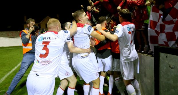 Shelbourne players celebrate with fans during last season’s First Division clash with Drogheda which saw the visitors win the league and return to the top flight. Photo: James Crombie/Inpho