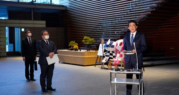 Japan’s prime minister,  Shinzo Abe, prepares to speak to reporters in Tokyo on Monday ahead of a meeting about the coronavirus pandemic. Photograph: Franck Robichon/EPA