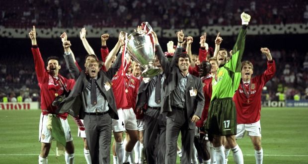 Paul Scholes and Roy Keane, who were suspended for the final, lift the European Cup. Photograph:  Alex Livesey/Allsport