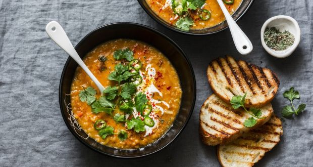 Turkish spiced lentil soup with fresh herbs and yoghurt, served with toast. 