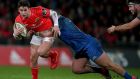 Munster’s Joey Carbery is tackled by Andrew Porter of Leinster during the Guinness Pro 14 game at  Thomond Park last December. Photograph: Bryan Keane/Inpho