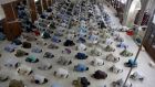 People attend evening prayers at a mosque in Karachi, Pakistan, on Sunday. Photograph: Fareed Khan/AP