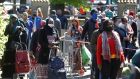 Residents line up during a food distribution by volunteers from the Aclefeu association in Clichy-sous-Bois near Paris. Photograph: Charles Platiau/Reuters