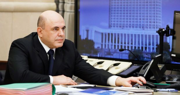 Russian prime minister Mikhail Mishustin chairs a meeting with members of the government via teleconference call in Moscow. Photograph: Dmitri Astakhov/ Sputnik/Government press service/EPA