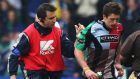 Tom Williams of Harlequins walks off with physio Steph Brennan to be replaced by team-mate Nick Evans in the closing stages of the 2009 Heineken Cup quarter-final at The Stoop. Photograph: David Rogers/Getty Images