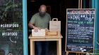 A restaurant owner in Barcelona, Spain, prepares his storefront to attend customers’ takeaway orders after the country begun loosening some of the strict movement restrictions it implemented. Photograph: EPA