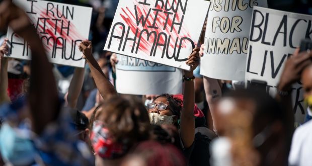 Demonstrators protest at the shooting dead of Ahmaud Arbery at the Glynn County courthouse in Brunswick, Georgia in May. Photograph: Sean Rayford/Getty Images