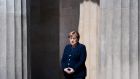German Chancellor Angela Merkel attends a wreath laying ceremony to mark the 75th anniversary of the end of the second World War, at the Neue Wache Memorial in Berlin on Friday. Photograph:  Filip Singer / Pool/ EPA