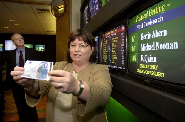 Small party risks: Mary Harney, leader of the PDs, placing a bet on whether her party would win eight seats in the 2002 election. The gamble paid off. Photograph: Brenda Fitzsimons/The Irish Times