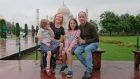 Emer Davis and Sean Brady with their daughters Zaira and Iseult at the Taj Mahal during monsoon season.