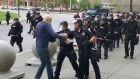 In this image from video provided by radio station WBFO, a police officer appears to shove a man who walked up to police in Buffalo, New York. Video shows the man appearing to hit his head on the pavement. Photograph: Mike Desmond/WBFO via AP