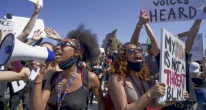  Black Lives Matter demonstrators march during a rally on Sunday in Santee, California in the 13th day of protests since George Floyd died in Minneapolis police custody on May 25th. Photograph: Sandy Huffaker/Getty Images