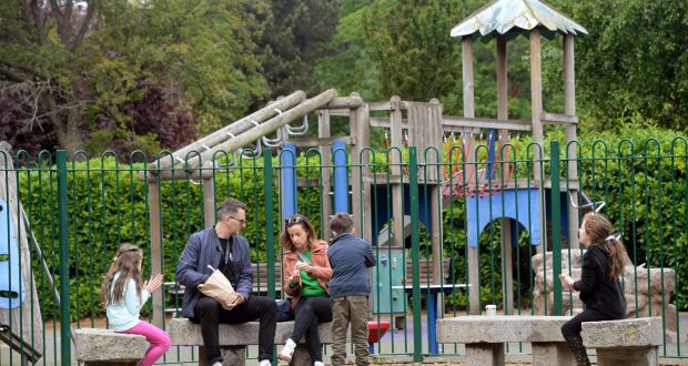Markus and Maeve Suttle, with their children Ruby, Kurt and Lucy,  having lunch outside the playground in St Stephen’s Green on Sunday. Photograph: Dara Mac Dónaill / The Irish Times