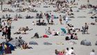 Dollymount beach, Dublin: The sunbathers and chattering masses. Photograph: Tom Honan