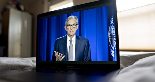 Jerome Powell, chairman of the US Federal Reserve, speaks during a virtual news conference seen on a laptop computer in Arlington, Virginia, on June 10th. The Federal Reserve put a floor under its large-scale asset purchases and projected interest rates will remain near zero through at least 2022 as policy makers seek to speed the economy’s recovery from the coronavirus recession. Photograph: Andrew Harrer/Bloomberg