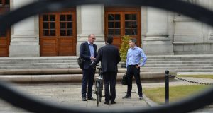  Simon Coveney and Paschal Donohoe greet Eamon Ryan  as he arrives for talks on government formation at Government Buildings. Photograph: Alan Betson
