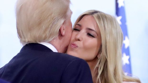 U.S. President Donald Trump kisses his daughter Ivanka at the Women’s Entrepreneurship Finance event during the G20 leaders summit in Hamburg, Germany July 8, 2017. REUTERS/Michael Kappeler, Pool