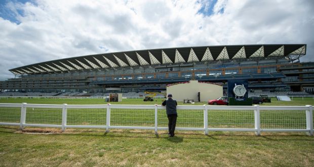 A member of the public looks on as the finishing touches are made at Ascot Racecourse. The Royal Ascot meeting will take place behind closed doors between Tuesday June 16th and Saturday June 20th. Photo: Edward Whitaker/PA Wire