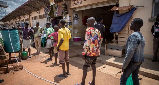 Street children queue to wash their hands outside Gulu main market before being given a meal. Photograph: Sally Hayden.