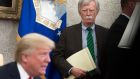 The then US national security adviser John Bolton stands alongside Donald Trump as he speaks during a meeting  in the Oval Office of the White House in Washington DC in May  2018. Photograph: Saul Loeb/AFP via Getty Images