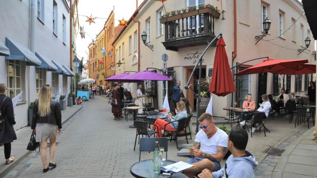 People sit in cafes during an event mimicking the Italian holiday experience in Vilnius, Lithuania. Photograph: Petras Malukas/AFP via Getty Images