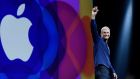 Tim Cook, chief executive officer of Apple, waves before speaking during the Apple World Wide Developers Conference in San Francisco