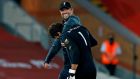 Liverpool manager Jürgen Klopp  hugs goalkeeper Alisson Becker after the victory over Crystal Palace. Photograph:    Phil Noble/Pool/AFP via Getty Images
