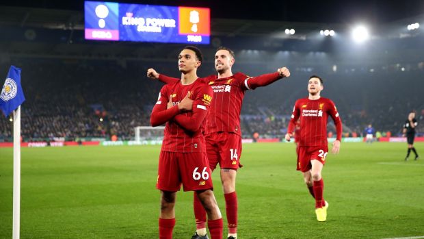 Trent Alexander-Arnold of Liverpool celebrates scoring his side’s fourth goal with Jordan Henderson and Andy Robertson during the Premier League match against Leicester City at The King Power Stadium on St Stephen’s Day. Photograph: Alex Pantling/Getty Images