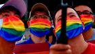 Peopel  take selfies during a Pride parade outside the Chiang Kai-shek Memorial Hall in Taipei. Photogaph: Sam Yeh/AFP via Getty Images