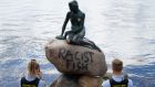 Police stand by the Little Mermaid statue in Copenhagen, Denmark, after it was vandalised. Photograph: Mads Claus Rasmussen/Ritzau Scanpix via AP